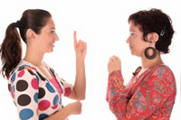 Two women using sign language.