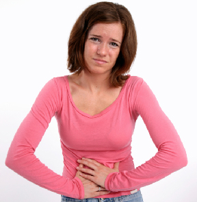 Photo of a teenage girl with a stomach ache.