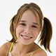 Girl with her hair in pigtails smiling