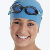 Girl wearing goggles and a swim cap.