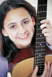 Girl holding a guitar.