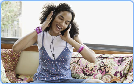 young girl wearing headphones listening to music