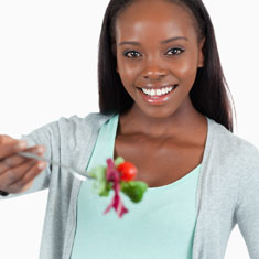 A girl eating a salad