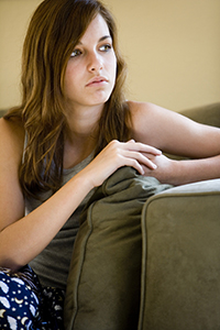 girl sitting on couch