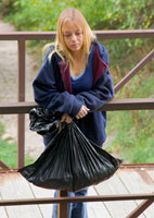 Blonde runaway girl with a trash bag.