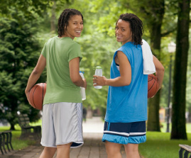 happy basketball player friends with water bottles and ball