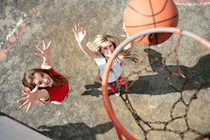 Girls playing basketball.