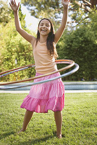 A girl hula hooping.