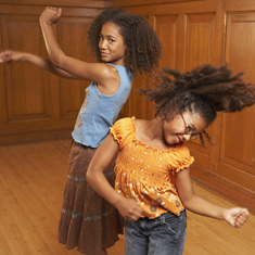 Two girls dancing.