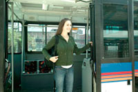 Girl getting off the bus.